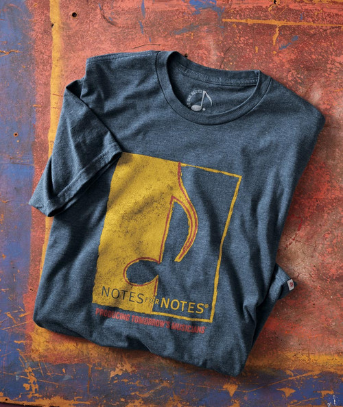 32 Bar Blues Doors Swing Open, folded dark gray T-shirt with a yellow and red graphic design of a musical note and the text "NOTES for NOTES" on a colorful distressed background.