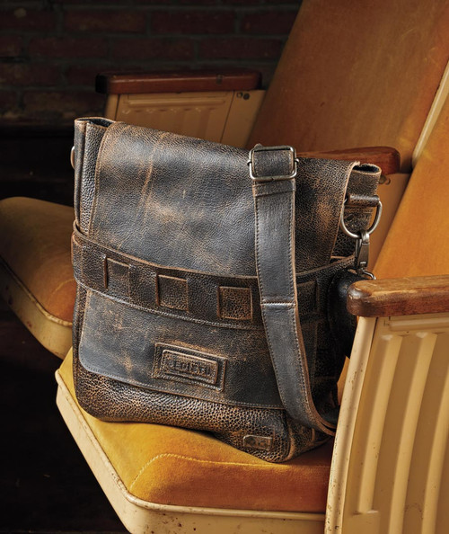 32 Bar Blues You Better Go Now, vintage leather bag on a mustard-colored chair.
