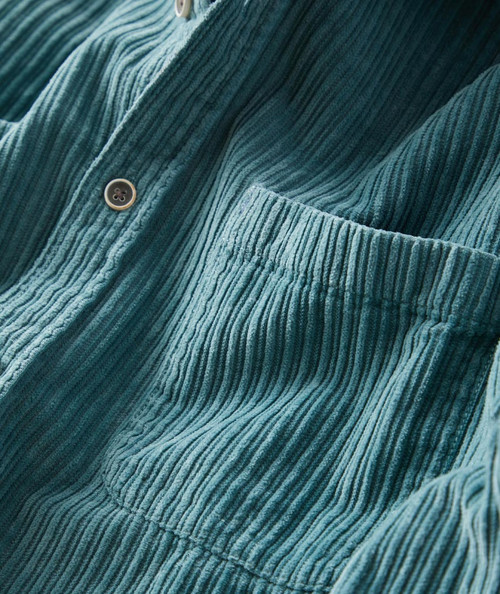 32 Bar Blues Smile Like That, close-up of teal corduroy shirt with pocket and buttons.