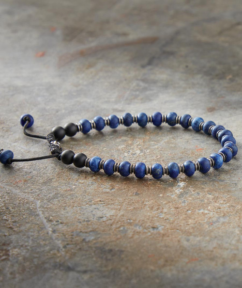 32 Bar Blues Blue On Black bracelet, a beaded jewelry piece featuring deep blue and black beads with metallic accents, designed for stylish and versatile accessorizing.