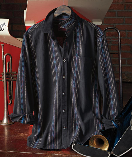 32 Bar Blues Deep Felix, stylish black men's shirt with vertical blue and white stripe patterns, button-up front, displayed on a hanger against a brick wall.