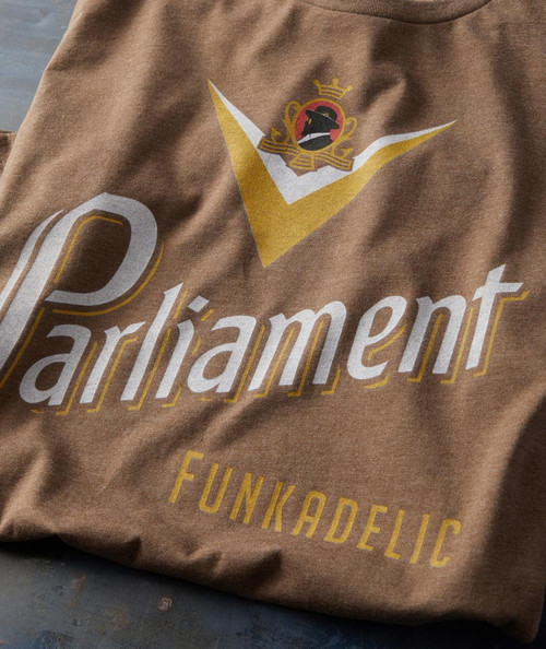 32 Bar Blues Some Fresh Delic T-shirt, brown casual t-shirt with a graphic design featuring a lion wearing a crown and the words 'Parliament Funkadelic' printed on it.