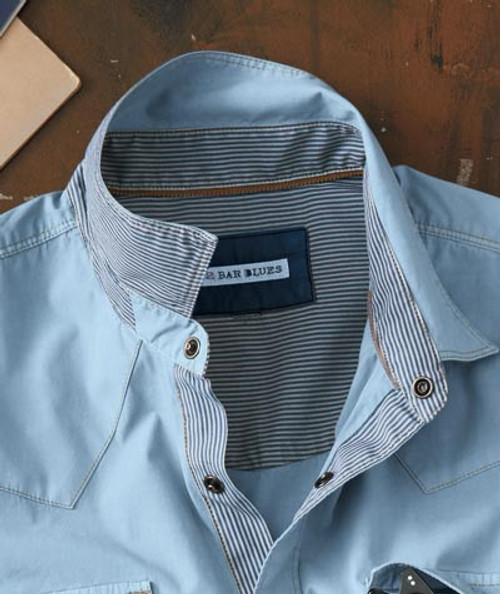 32 Bar Blues The Scene Is Clean - Light Blue, close-up of a light blue men's dress shirt with a striped inner collar and button details.