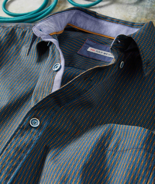 32 Bar Blues City Lights shirt, close-up view of a stylish patterned button-up shirt with a blue and gold intricate design, showcased on a flat surface.