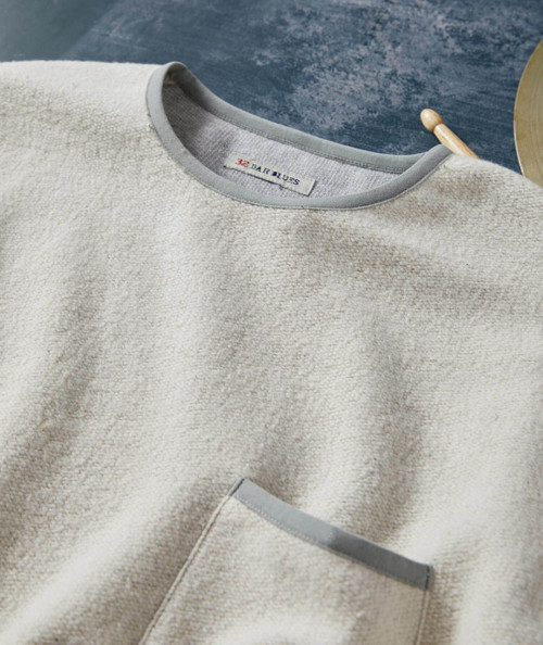 32 Bar Blues Old Sugar Bear, cream colored fleece sweatshirt with gray trim on the collar, pocket, and cuffs. Close up of collar and top of pocket.