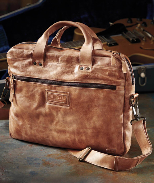 32 Bar Blues Travelin' Man carrying case, stylish brown leather travel bag with a front zipper pocket and handle, suitable for guitar accessories.