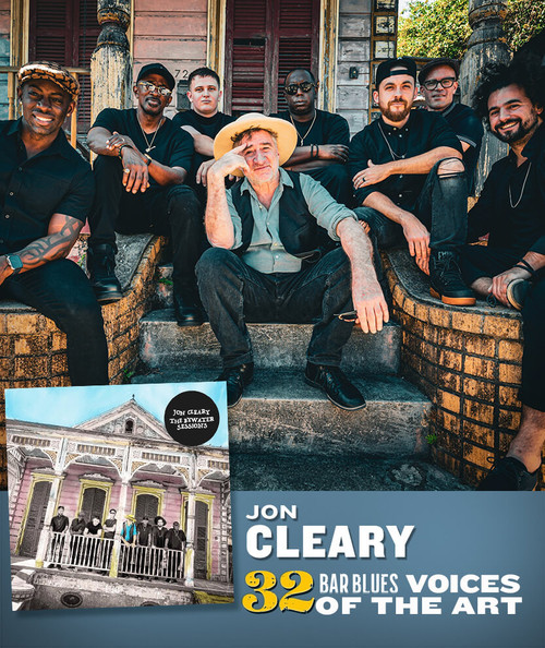 32 Bar Blues Jon Cleary - The Bywater Sessions, a group photo of musicians sitting and standing outside a vintage building with wooden shutters, showcasing a diverse band of artists.