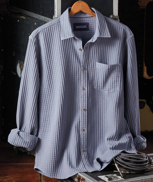 32 Bar Blues I Hit The Jackpot, a long sleeve striped blue and white shirt with a front pocket, hanging on a wooden hanger.