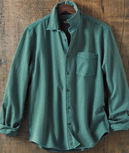 Bluegrass Break Up, green textured casual button-up shirt with a front chest pocket hanging on a wooden background.