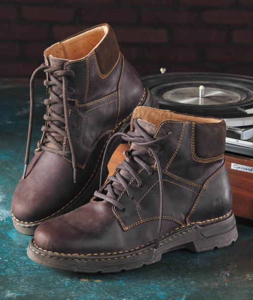 Chunk O' Funk boots, pair of rugged black leather lace-up ankle boots with yellow stitching on the leather and a brown suede cuff at the top.