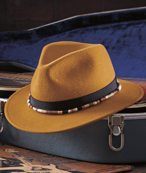 Don't Forget Your Hat, stylish brown fedora hat with black ribbon and colorful beaded band, placed on a vintage suitcase.