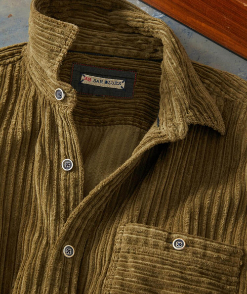 Over Under Sideways Down, brown corduroy jacket with buttoned front and chest pocket.
