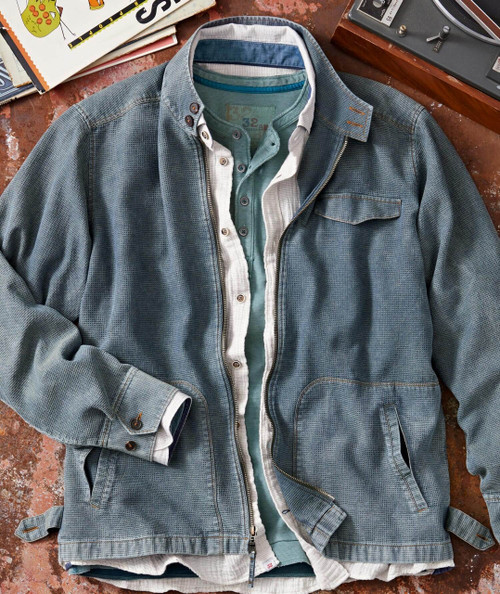 Fast Ride, denim jacket with layered casual shirts on a rustic surface.