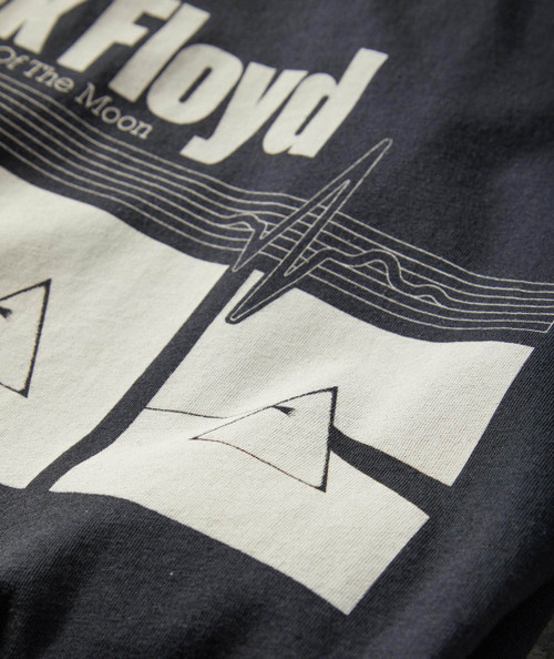 Prism T-Shirt, close-up of black and white graphic design on fabric featuring the word 'Prism' and geometric patterns.