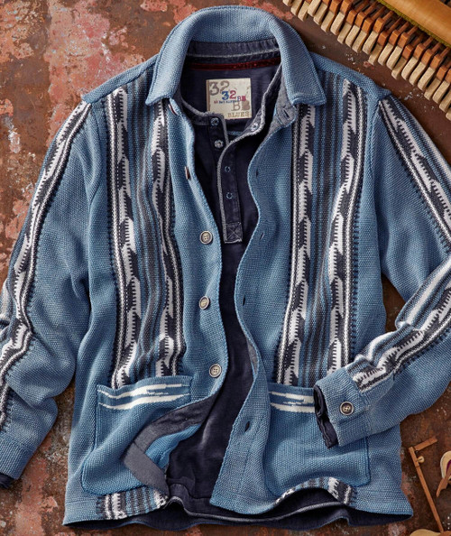 Let Me Be Your Side Track, a vintage blue and black striped button-up shirt with intricate woven patterns, laid flat on a rustic surface.