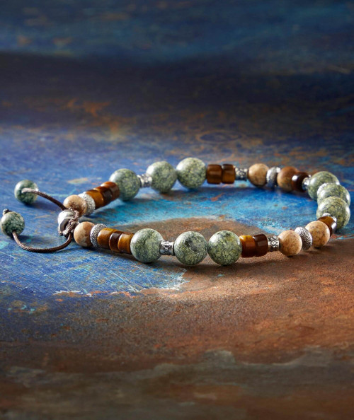 Dooji Wooji, beaded necklace featuring green and brown natural stone beads with metallic accents.