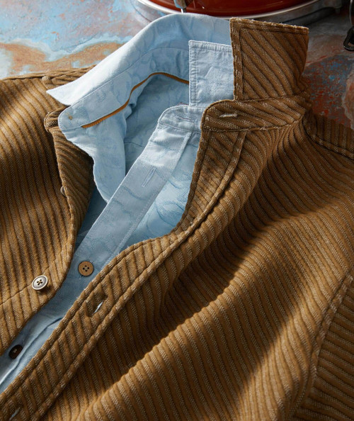 Sweet Rhythm, a brown corduroy jacket with a blue patterned lining showing the inside pocket and buttons.