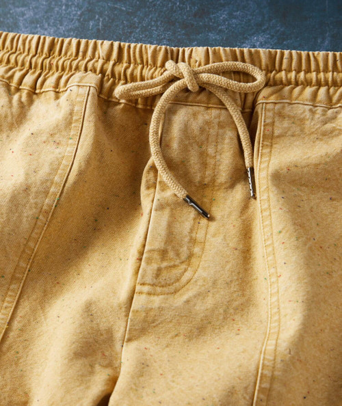 Step To It, close-up of beige drawstring shorts with elastic waistband and front pockets.