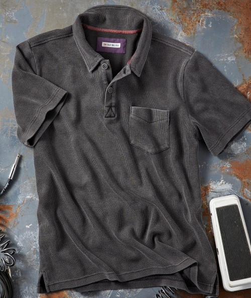 Get It Right, stylish men's checkered polo shirt with a front pocket, laid flat on a textured surface.
