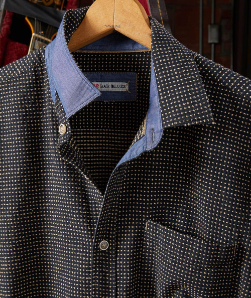 Bumpin' men's casual shirt, black fabric with small white polka dots, with contrasting blue denim collar and inner placket, button-front style, front chest pocket.