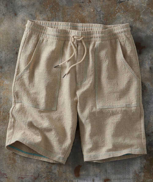Drifting Away, beige textured shorts with drawstring waistband and large front pockets.