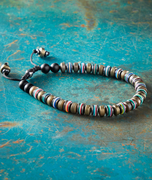 Swagism Necklace, colorful and stylish beaded jewelry on a textured blue background.