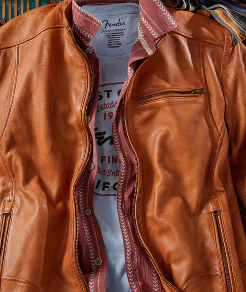 Make My Getaway, stylish leather jacket with multiple zippers and a layered shirt underneath.