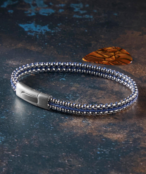 It Takes Two, Stylish stainless steel and navy beaded bracelet on dark textured surface with brown tortoise shell guitar pick