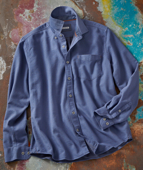 Boogie Bump, a blue checkered long-sleeve men's shirt, laid flat on a colorful, textured surface.