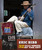 32 Bar Blues Eric Bibb - Live At The Scala Theatre album cover, musician sitting on stairs playing guitar, wearing a wide-brim hat and denim jacket.