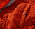32 Bar Blues Diamond Joe, close-up of burnt orange quilted quilted jacket with snap button detail.