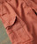 32 Bar Blues Freedom Machine, close-up image of the orange-brown fabric of the shirt with visible stitching and textured fabric appearance.