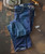 Product 32 Bar Blues No Better Than This - Medium Indigo, denim jeans folded on a rustic surface with a vintage lamp and an iron skillet nearby.