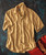 32 Bar Blues Honey In A Hurry, beige short-sleeve button-up shirt with a chest pocket laid flat on a dark textured background with a guitar nearby.