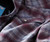 32 Bar Blues King Of All Kings, close-up of a plaid shirt with button details.