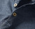 32 Bar Blues Samba Blue, close-up of a striped fabric shirt with dark and light blue lines and two decorative buttons.