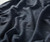 32 Bar Blues Samba Blue fabric, close-up view of soft, textured, striped material with a rhythmic pattern in blue tones.