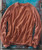 32 Bar Blues Bumpity Bump, a rust-colored long-sleeve shirt with a textured fabric and relaxed fit.