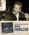 32 Bar Blues Jeff Hamilton Trio - Live From San Pedro, black and white photograph of Jeff Hamilton passionately playing drums during a live jazz performance.