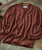 32 Bar Blues Alright Okay You Win, brown patterned knit sweater with textured diamond and honeycomb motifs.