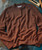 32 Bar Blues Another 'Nother men's brown textured crewneck sweater with ribbed cuffs and hem, laid flat on a surface.