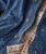 32 Bar Blues Beef Stew Blues, close-up of denim jacket with detailed buttons and inner lining with red and blue floral pattern.
