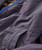 32 Bar Blues You Flip Me jacket, close-up of the dark gray fabric with a zippered pocket detailing.