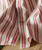 32 Bar Blues Hot Bricks, close-up image of a textured red and white striped fabric with a button detail.