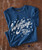 32 Bar Blues We Had It All T-shirt, blue T-shirt with white vintage-style text and stars design celebrating Willie Nelson's live in Austin 1973.