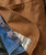 Better Ways, close-up of brown fabric with detailed stitching and a small embroidered loop, showing the quality and design of the product.
