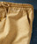 Step To It, Close-up of beige sweatpants with a speckled pattern, elastic waistband, and drawstring.