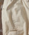 Neutral Zone, close-up of beige pants made from natural fabric with front pocket and waistband.