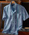 Perfect Imperfection, men's short-sleeve casual shirt with a blue, grey, and white abstract pattern hanging on a wooden hanger.