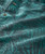 Lion Tamer, fabric close-up with tropical leaf pattern and button details.